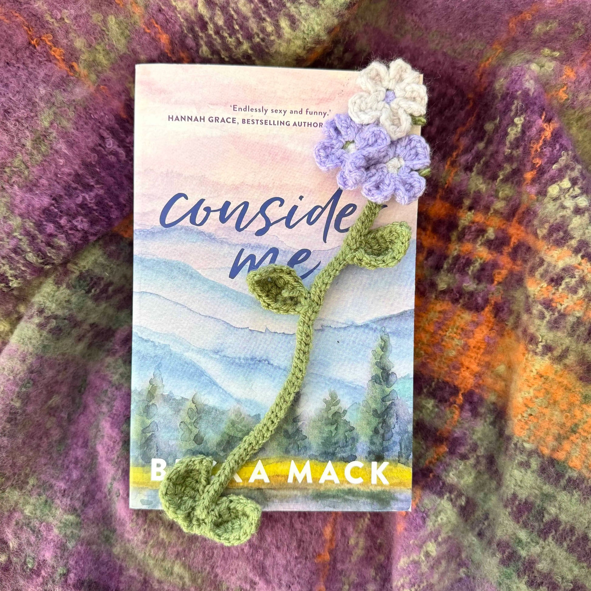 Flower bookmark on a textured fabric background